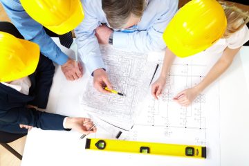 Contractors with blue prints with contractors insurance in Oldsmar, FL 