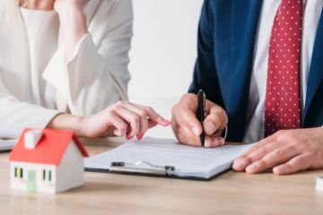 An agent and client in Odessa discussing Property insurance plans